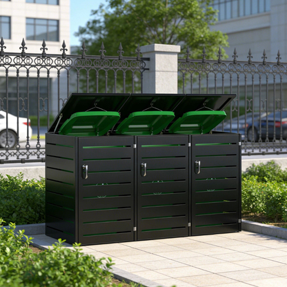 Black and green waste bin system in an outdoor setting with a building and fence in the background.