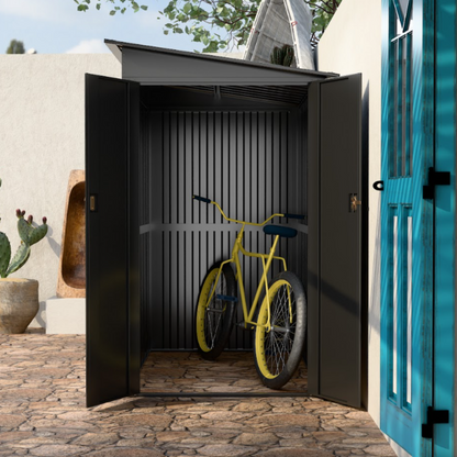 Metal garden shed with sloped roof for rainwater drainage.