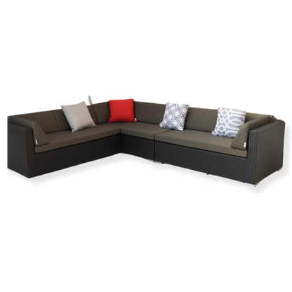 A large L-shaped outdoor sectional sofa with cushions in various colors, including a red accent pillow, placed on a white background.