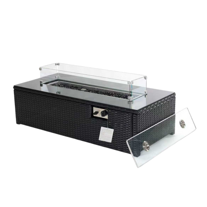 Black wicker outdoor fire pit table with a clear acrylic wind guard and a separate clear ash cover, shown on a white background.