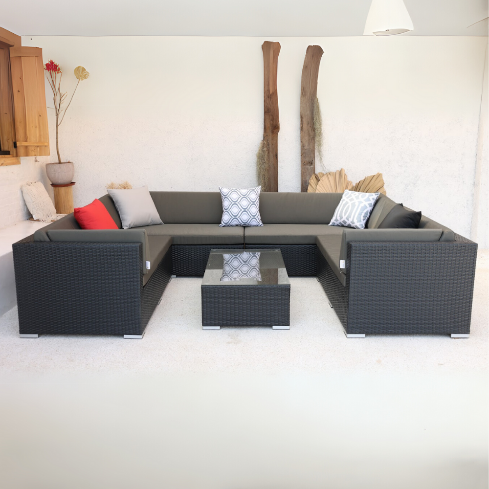 A U-shaped outdoor sectional sofa with handwoven PE rattan and a sturdy aluminum frame, featuring gray cushions and pillows, viewed from a slightly elevated angle.